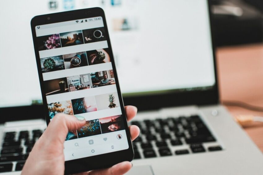 A photo of a smartphone user looking at photos on social media