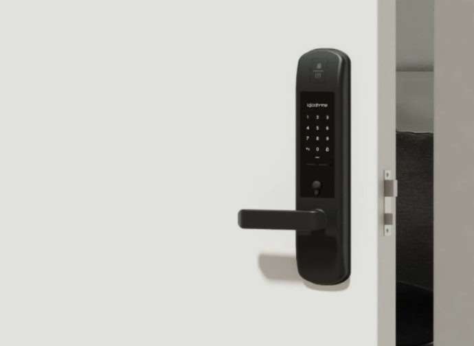 The Igloohome Mortise Lock installed on an open white door