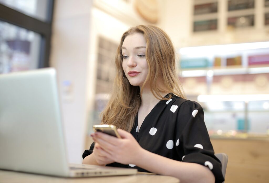 A photo of a woman looking at laptop to show listing standing out