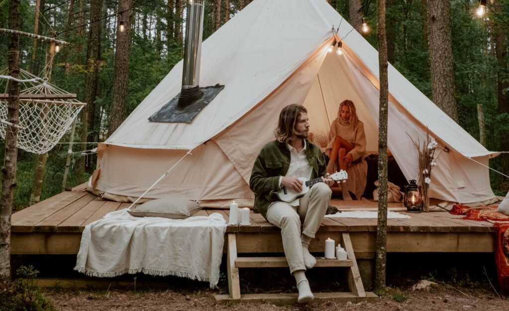 Two people glamping in the woods