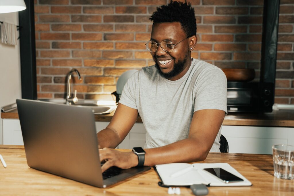 A photo of a man on a laptop to show that automation makes things easier