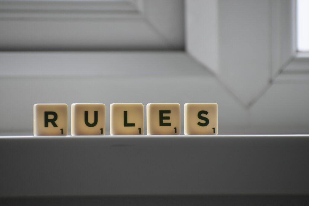 A photo of blocks lined up to spell Rules