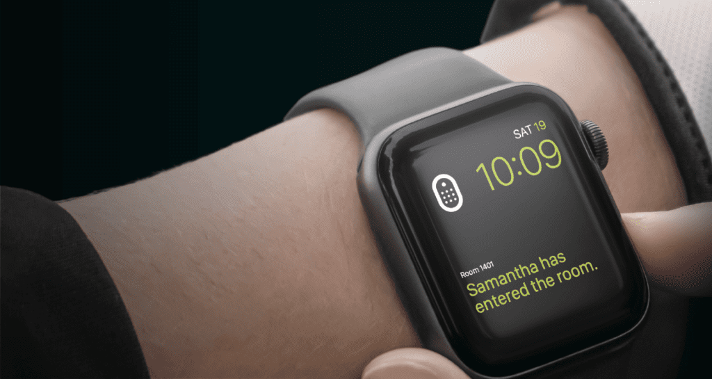 Smart watch showing a notification of a guest entering the room.